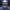 Duck Skellington facing the camera in a moonlit gothic Halloween town